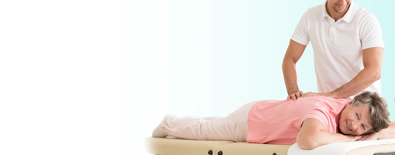 An elderly woman receiving chiropractic care on her spine by a chiroprator.