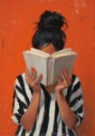 Πίνακας σε Καμβά AFROCENTRIC WOMAN HIDING BEHIND BOOK ORANGE