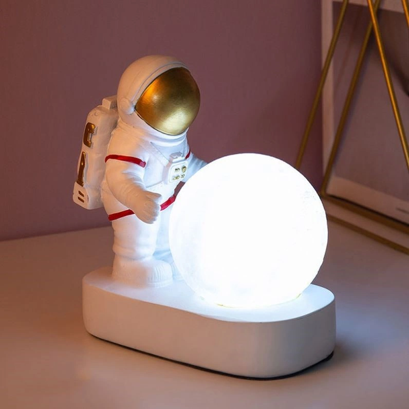 Astronaut Holding a Moon Lamp